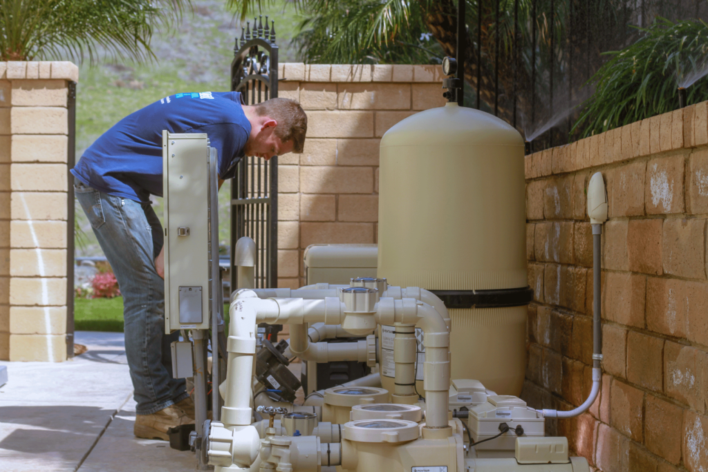 Southcoast technician inspecting pool equipment